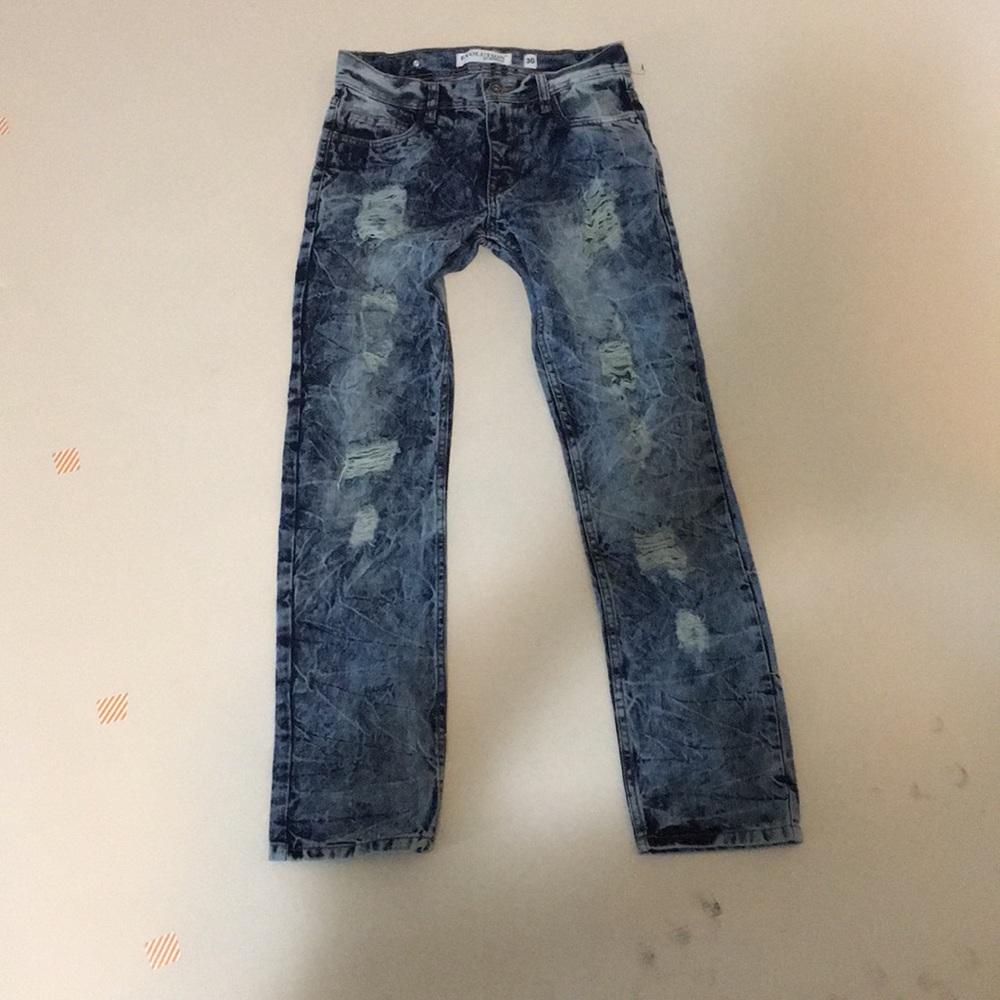 Distressed blue ripped jeans